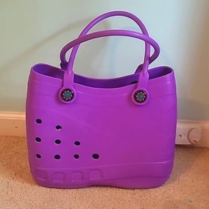 Purple plastic shoulder bag